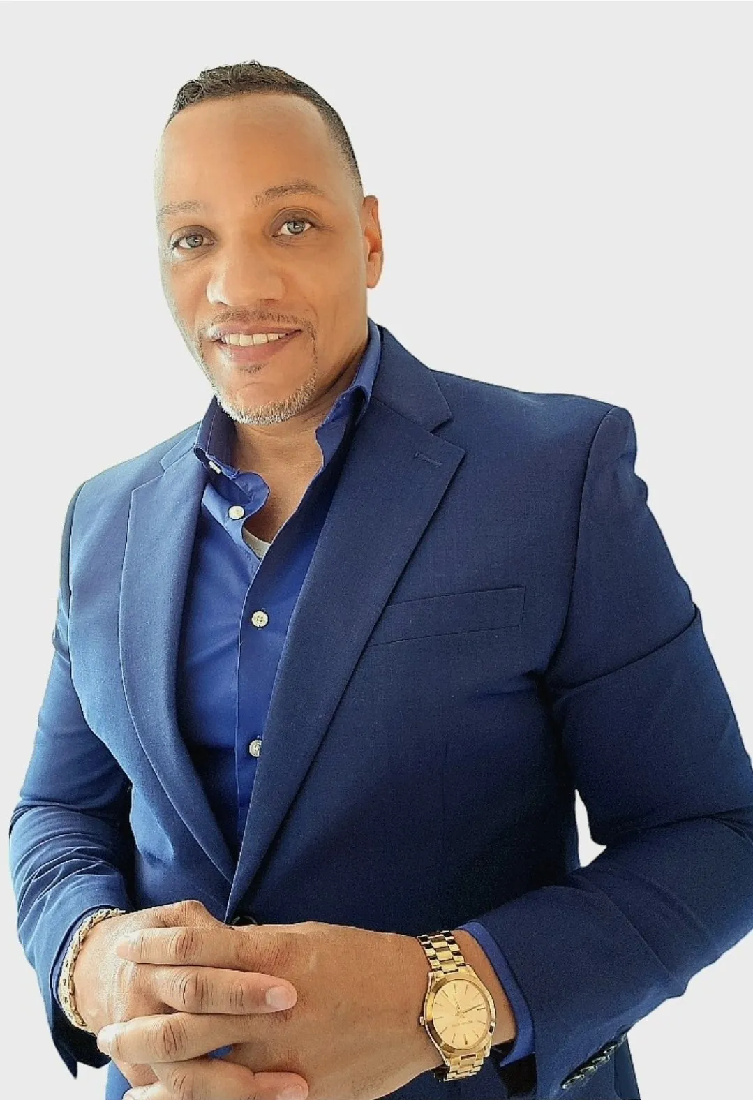 Chuck Tolbert in a blue suit